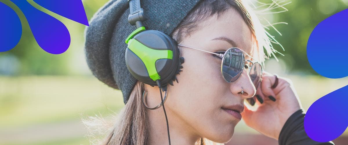 women listening to music with her headphone under $200